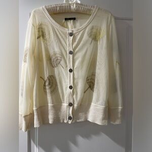Large- off white cropped sweater with pale yellow and like gray embroidery.